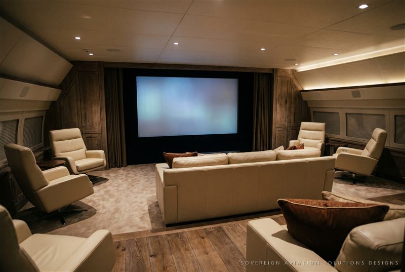 Private cinema lounge with starlight ceiling aboard a widebody aircraft